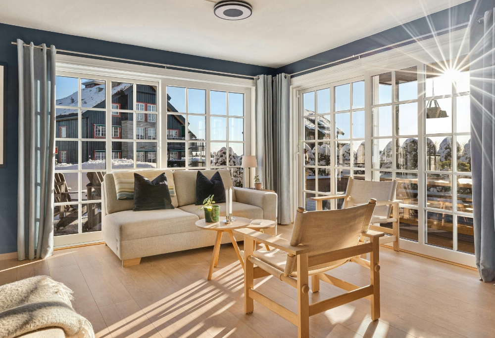 bright modern Los Angeles living room with floor-to-ceiling windows and sunlight by REAL Arch