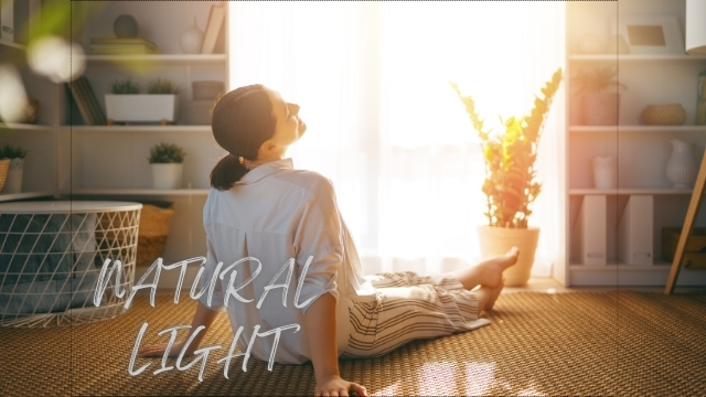 woman relaxing indoors in natural sunlight near window in Los Angeles home by REAL Arch